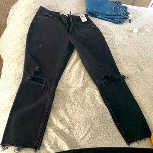 Black straight legged ripped black jeans